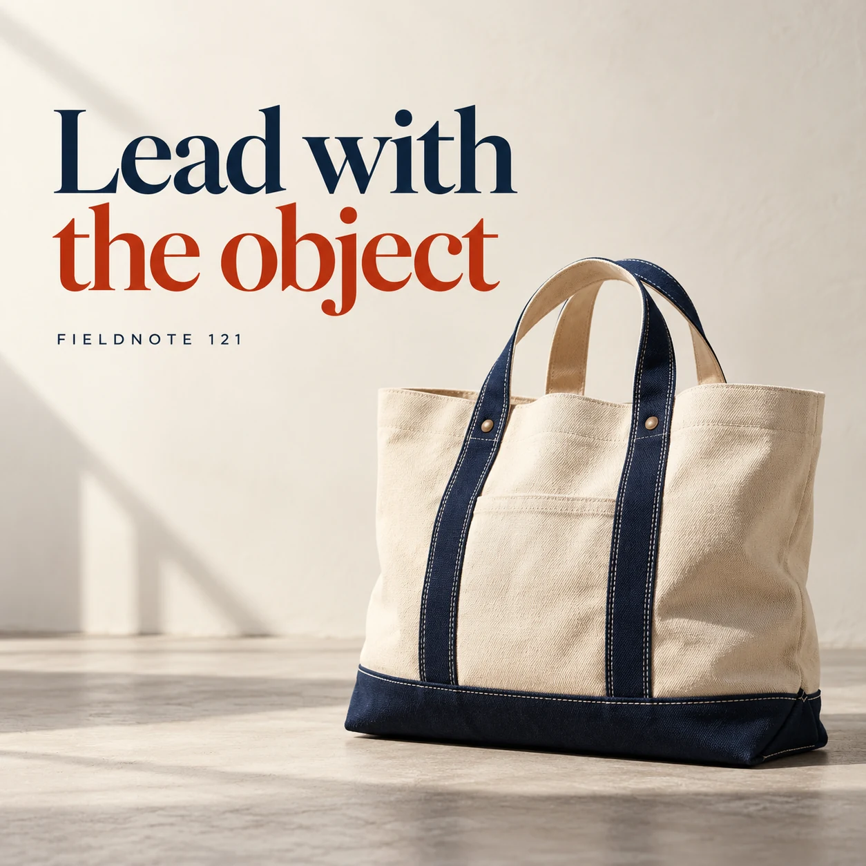 Illustrative campaign concept: large canvas bag against a restrained ivory backdrop, with the headline “Lead with the object” and fictional FIELDNOTE branding.