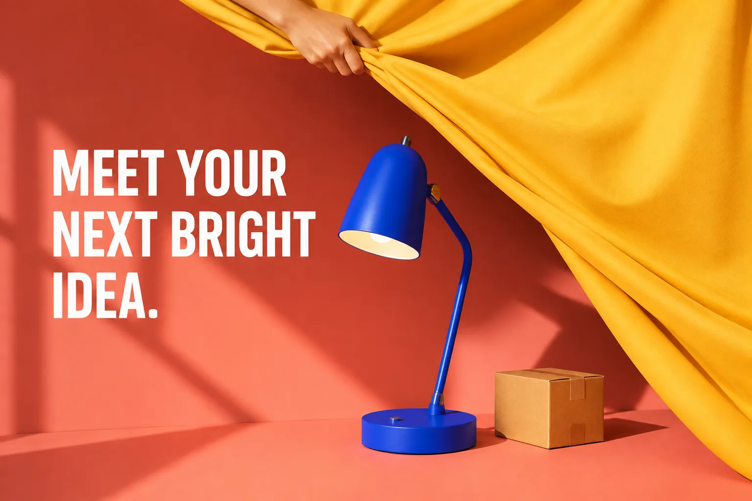 A blue desk lamp revealed by a yellow curtain with the line ‘Meet your next bright idea.’